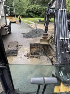 active-sewer-line-repair-jobsite-excavator