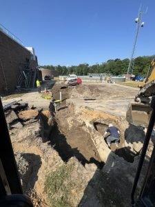 excavator-digging-for-sewer-line-installation