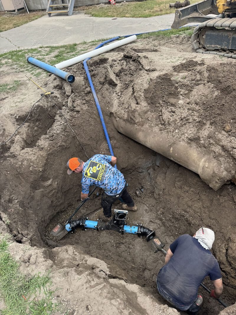 Drain & Sewer Services Installing sewer pipes in deep trench