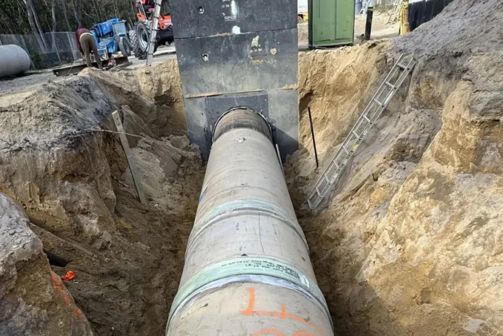 Large commercial sewer main exposed during excavation in Evesham NJ, part of a project requiring commercial sewer cleaning and system inspection.