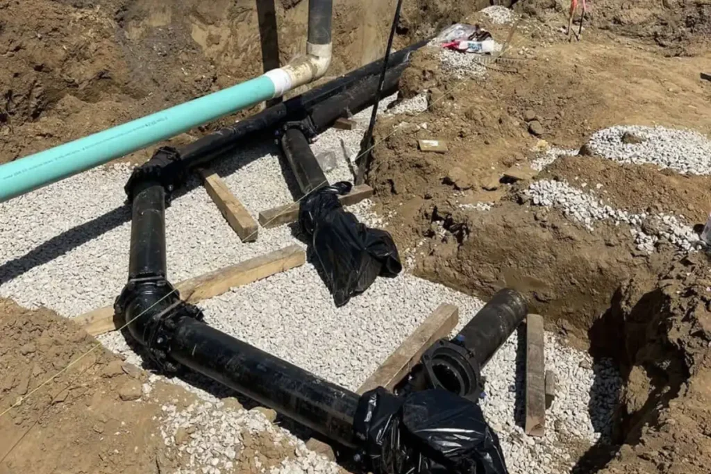 Exposed sewer piping system at a commercial site in Evesham NJ, showing preparation work that supports commercial sewer cleaning and maintenance.