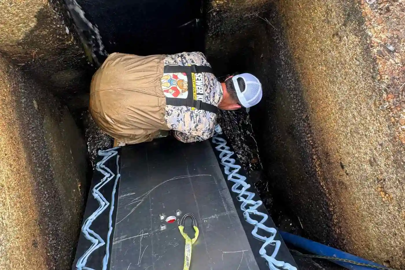 Septic system inspection A technician performing septic system inspection in Evesham, NJ to ensure the tank and lines are working properly.