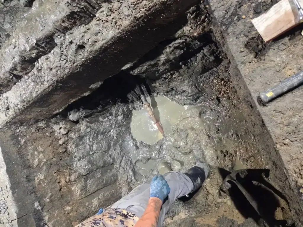 How Old Clay and Cast Iron Sewer Lines Fail in Cherry Hill Homes Broken old sewer pipe found in a flooded pit, a failed line like those in older Cherry Hill homes