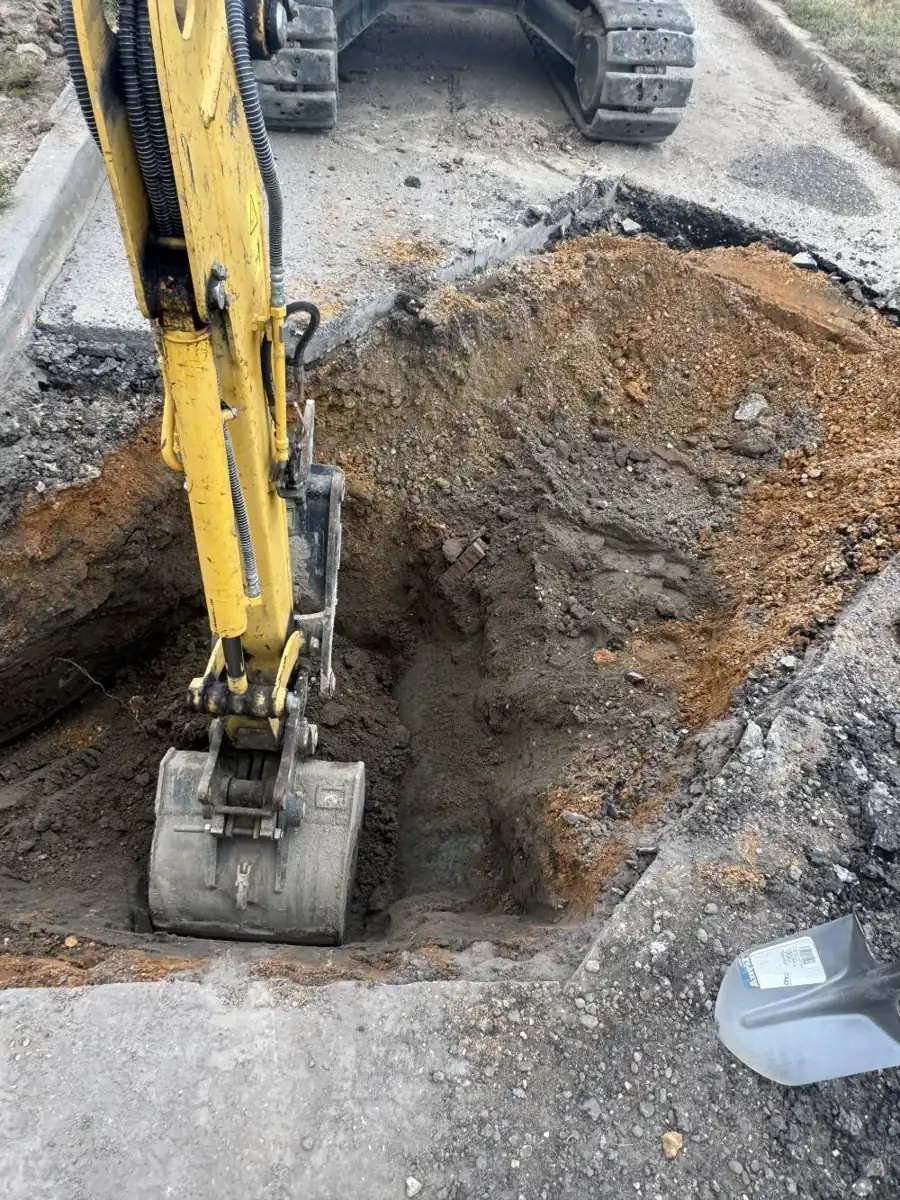 Sewer Line Repair near Cranberry Pines Elementary School, NJ Excavator working an open trench for a sewer line near Cranberry Pines Elementary School, NJ