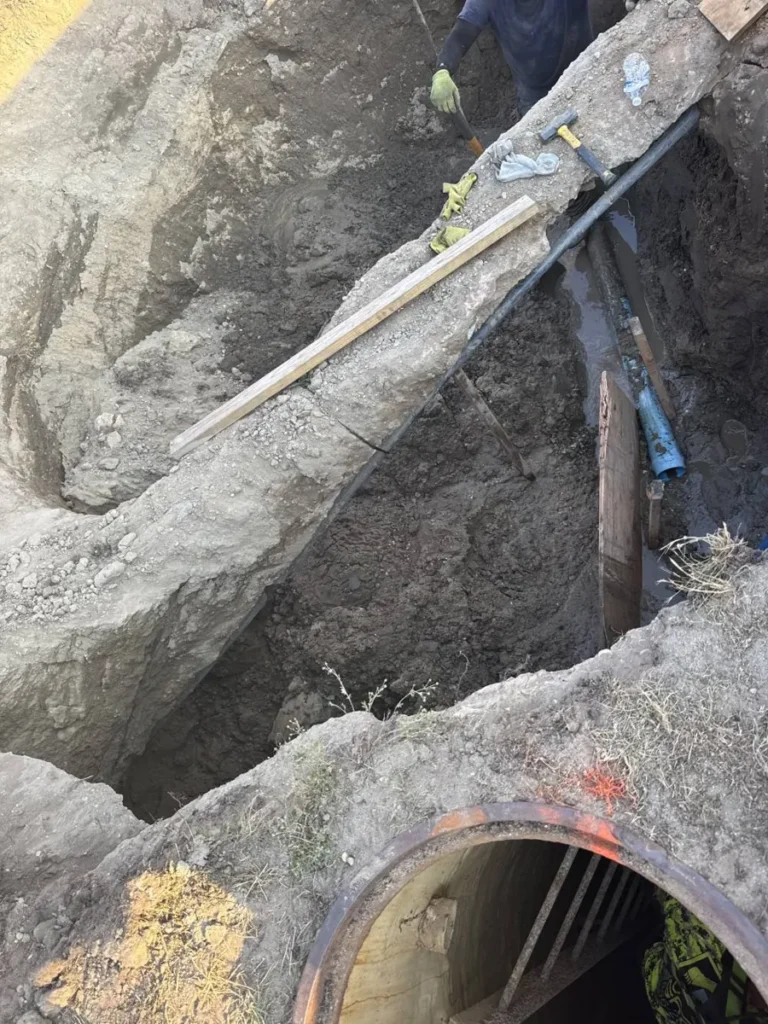 Deep open-cut trench dug to reach an old sewer pipe in Cherry Hill Township, NJ