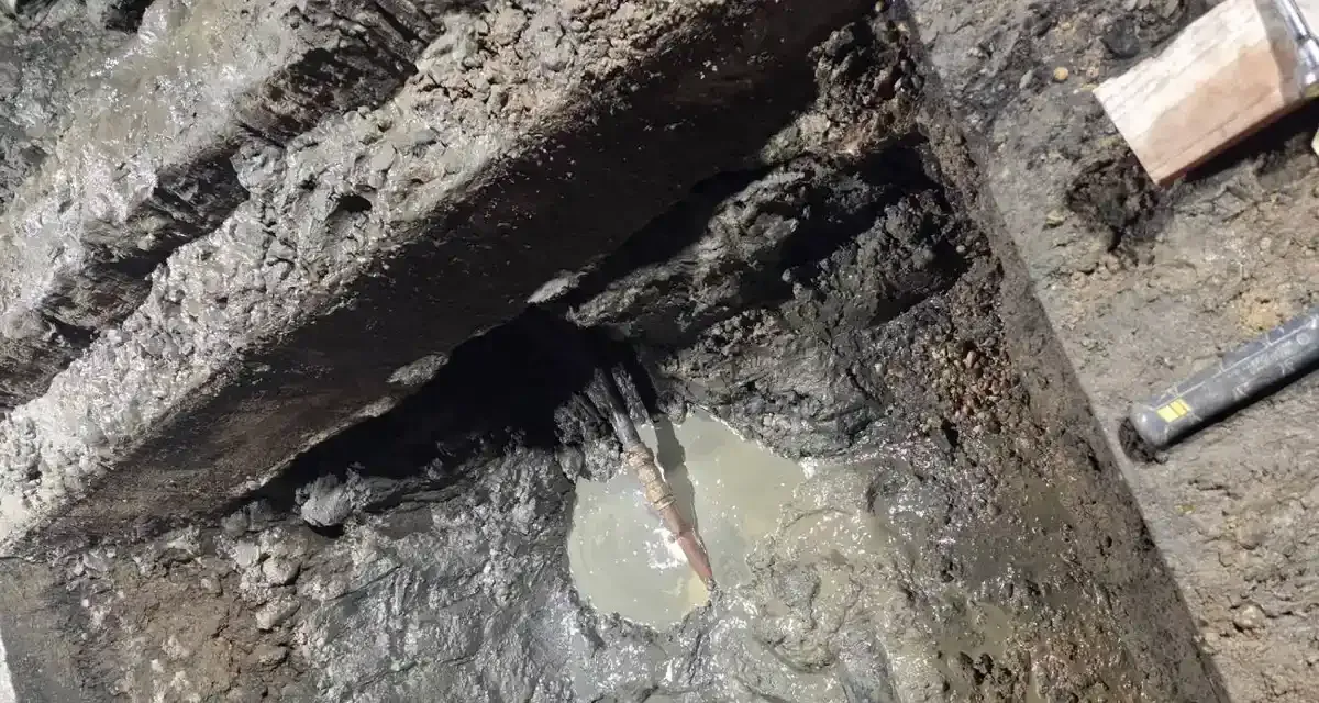 Broken old sewer pipe found in a flooded pit during a South Jersey dig