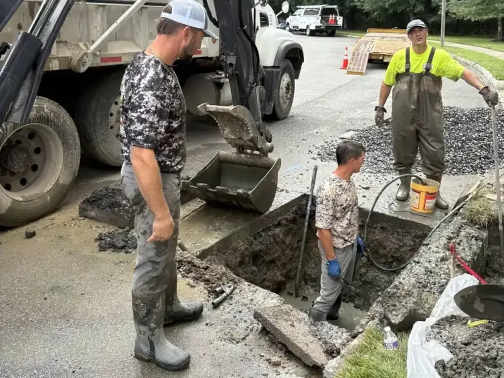 How Long Your Evesham Lawn Takes to Recover After Sewer Line Repair Sewer Kings crew clearing the dig at the curb after a sewer line repair in Evesham, NJ