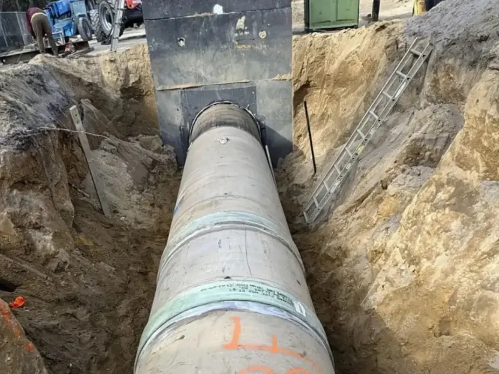Large sewer pipe set in a deep open trench on a job in Evesham, NJ